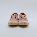 Pair of pink children's shoes on a white background
