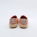 Pair of pink sneakers with 'Pita Pata' labels on a white background