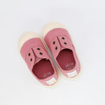 Pair of pink children's shoes with 'Pitta' branding on a white background