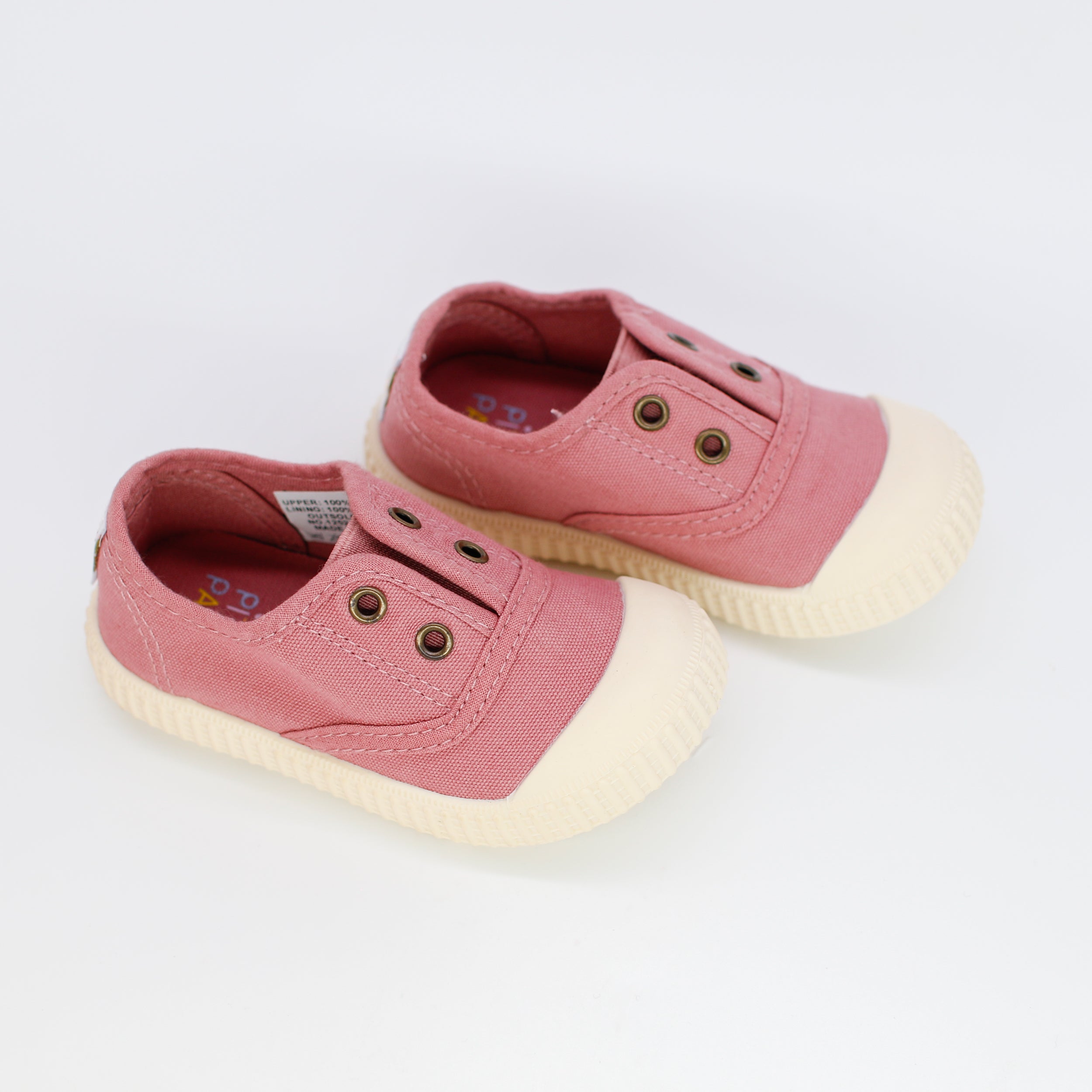 Pair of pink children's sneakers on a white background