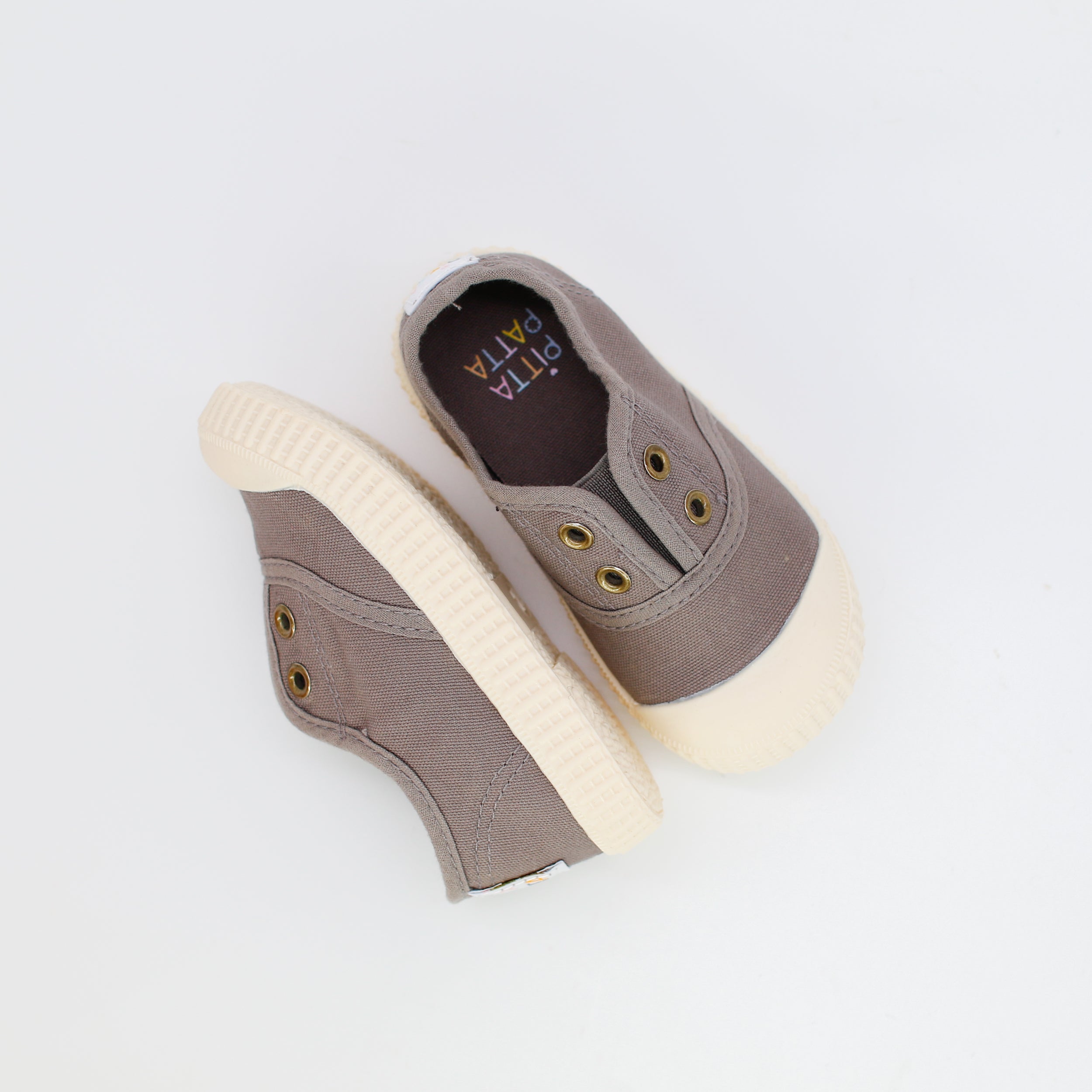 Pair of brown high-top sneakers with white soles on a light gray background